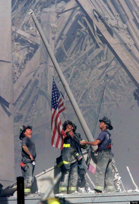 Firefighters Raise A U.S. Flag At The Site Of The World Trade Center